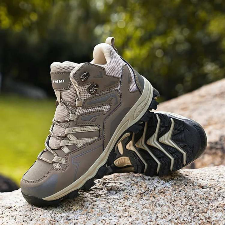 Men's all-terrain hiking boots, brown leather, orange laces, rugged sole for outdoor adventure