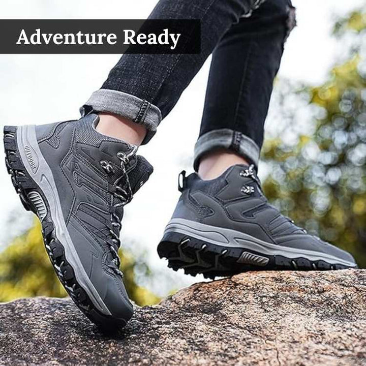 Close-up of men's rugged hiking boot sole, showcasing deep lugs for superior grip on trails