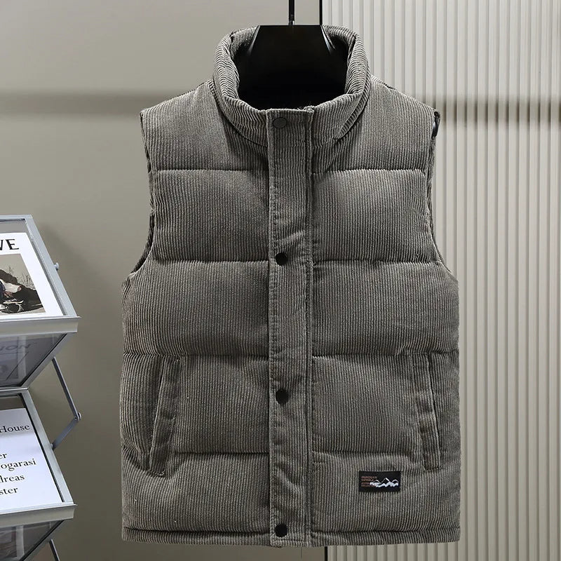 Stylish men's insulated puffer vest, sleeveless & ribbed for modern casual wear.