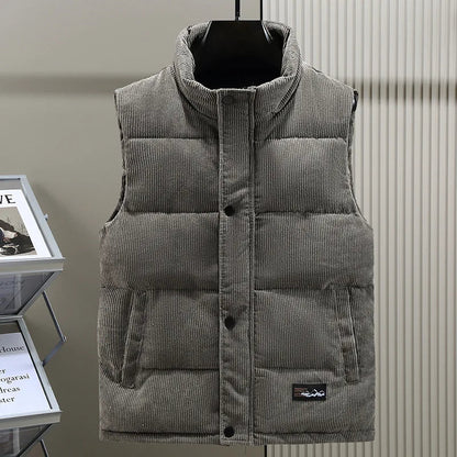 Stylish men's insulated puffer vest, sleeveless & ribbed for modern casual wear.