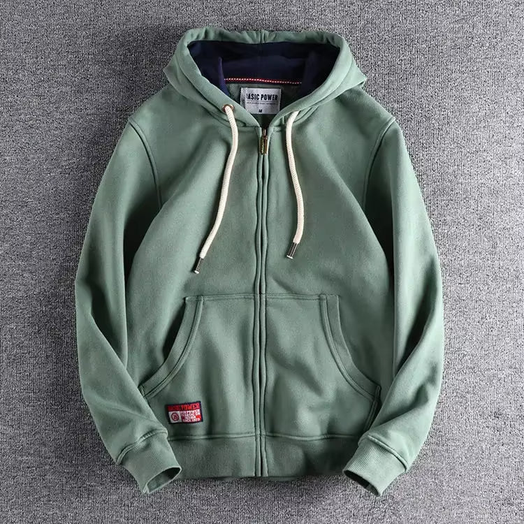 Man wearing a comfortable Apex full-zip hoodie, ideal for casual wear, warmth, & everyday layering.