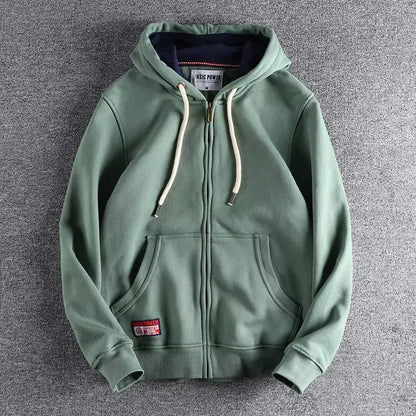 Man wearing a comfortable Apex full-zip hoodie, ideal for casual wear, warmth, & everyday layering.