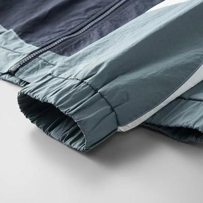 Apex men's lightweight windbreaker jacket, ideal for active protection. Urban, casual, and water-resistant outerwear.