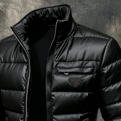 Stylish men's black puffer jacket for winter. Heavy, warm outerwear, perfect for cold weather fashion.