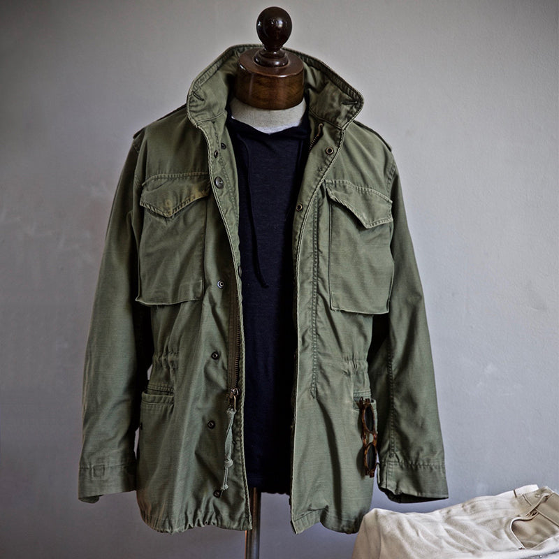 Stylish men's black utility jacket with hood, Archer field jacket design for rugged casual or outdoor use.