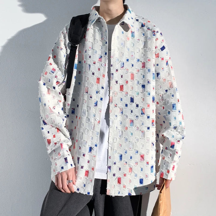 Close-up of a colorful men's artisan pattern casual shirt, showcasing its unique design & lightweight fabric.