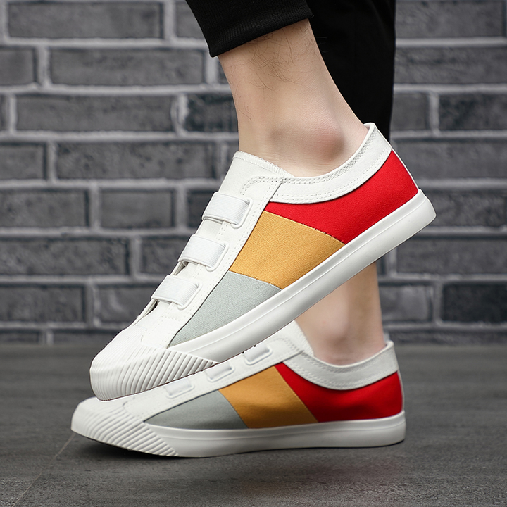 Impressionist men's fashion sneakers, comfortable with stretch lace and color block design.