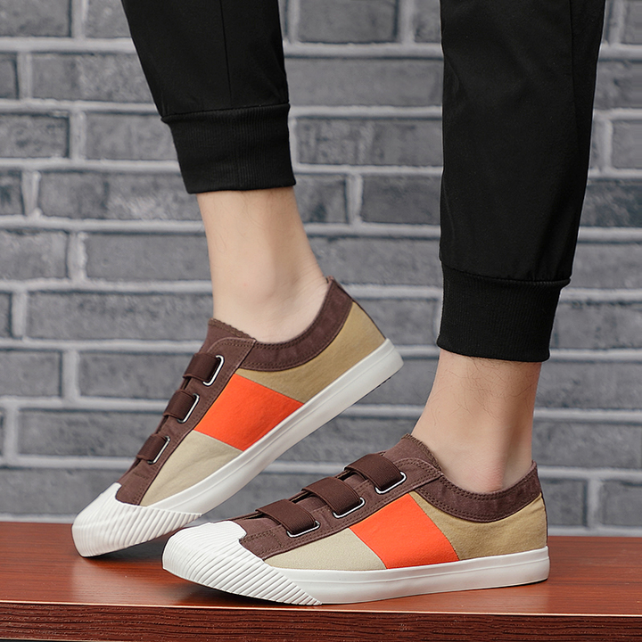Men's impressionist casual sneakers, featuring a unique color block design and stretch lace.