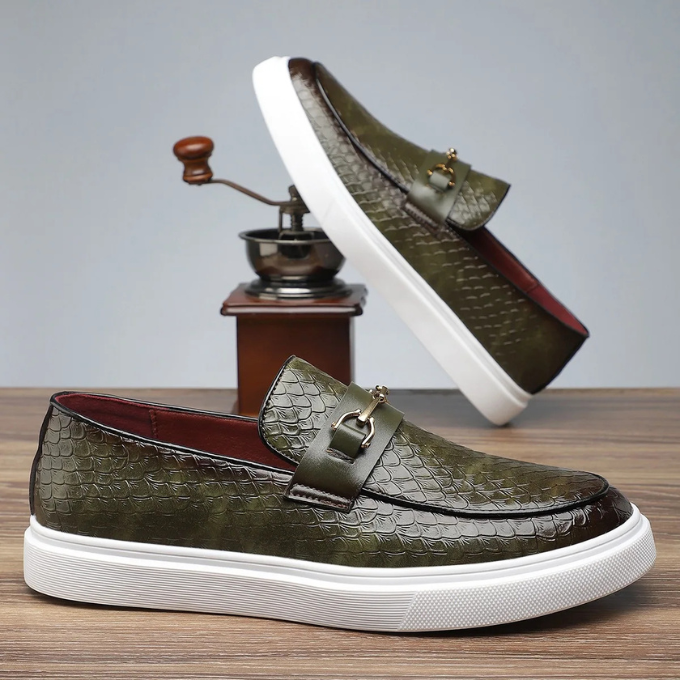 A pair of men's Aureo embossed loafers with gold accents, ready to complete any stylish men's fashion outfit.