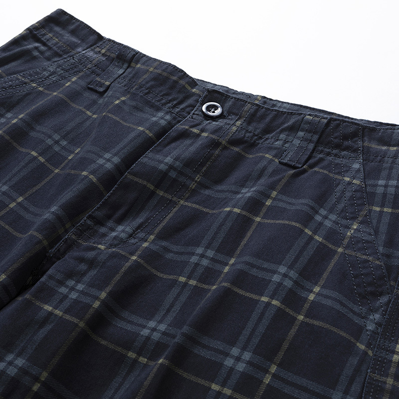 Rugged men's outdoor shorts, check pattern cargo style. Essential travel gear for adventures.