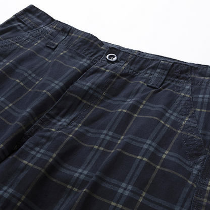 Rugged men's outdoor shorts, check pattern cargo style. Essential travel gear for adventures.