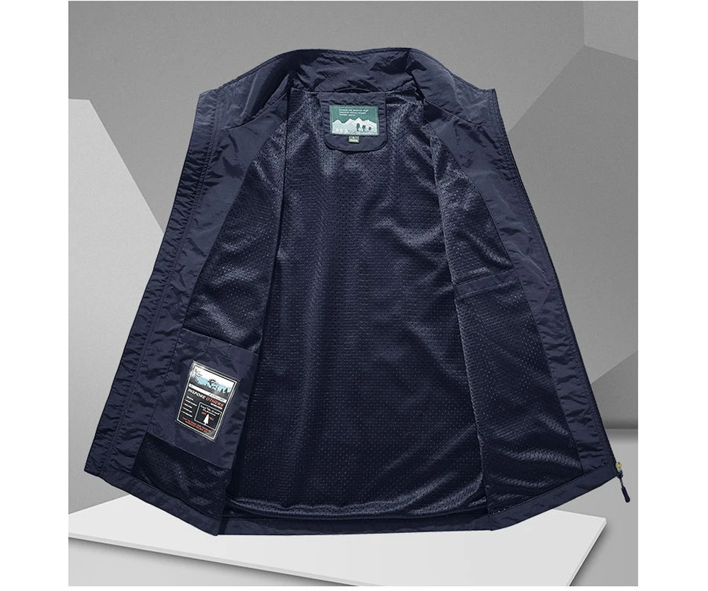 Lightweight men's backcountry vest with breathable mesh panels & numerous pockets for outdoor adventures.