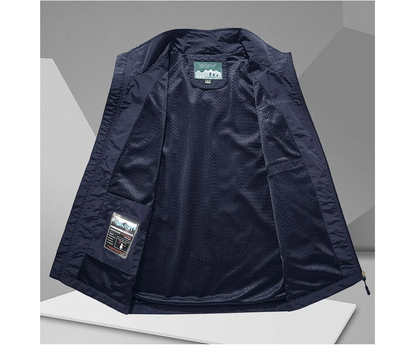 Lightweight men's backcountry vest with breathable mesh panels & numerous pockets for outdoor adventures.
