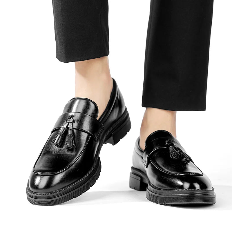 Stylish men's slip-on tassel loafers with sleek design, ideal for a refined, comfortable look.