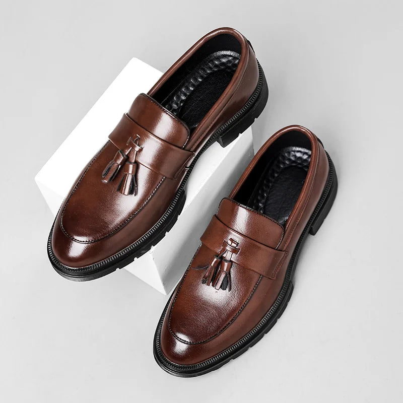 Detailed view of men's dress tassel loafers, showcasing polished finish and comfortable design.