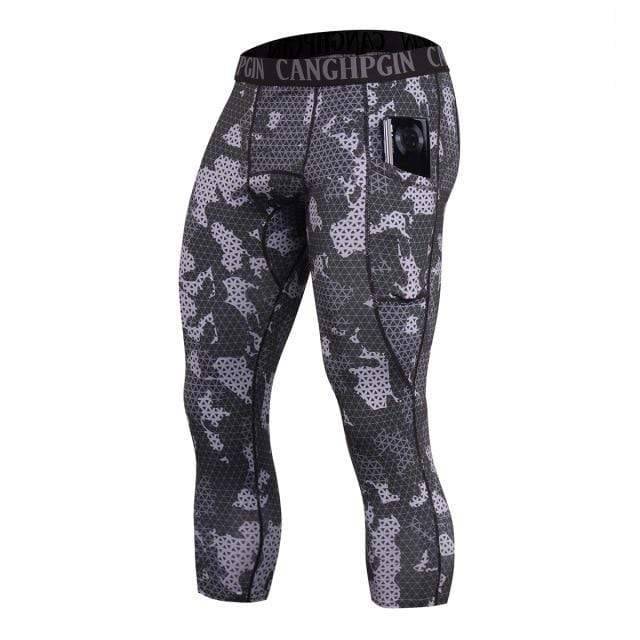 Men's activewear capri tights, black compression, engineered for running and athletic performance.
