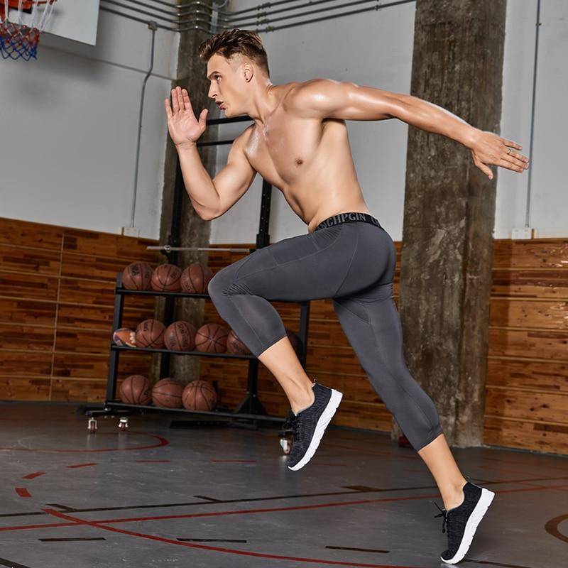 Men's capri running tights, compression activewear for enhanced performance and support.