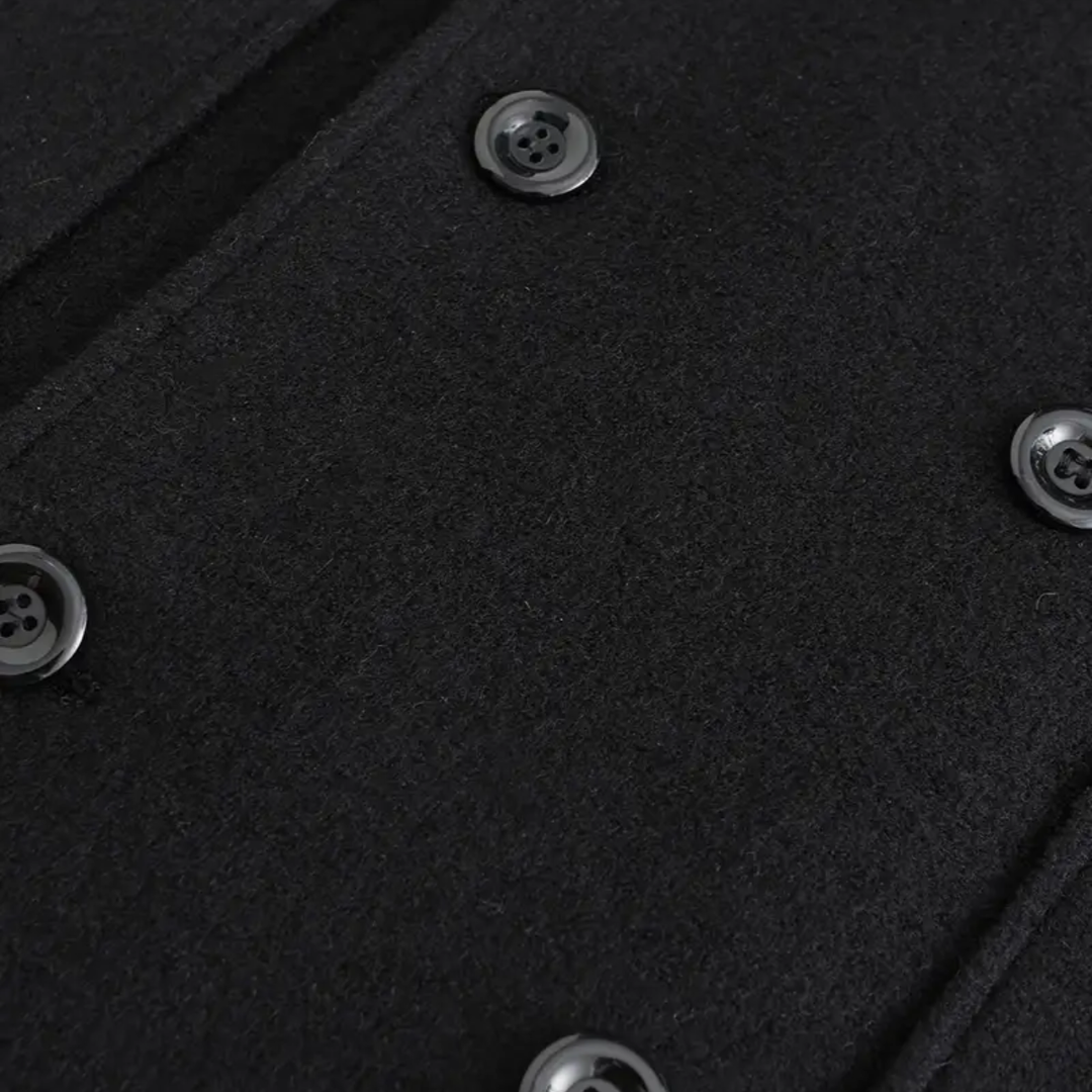 Stylish men's black double-breasted overcoat. Perfect tailored long winter coat for business and formal occasions.