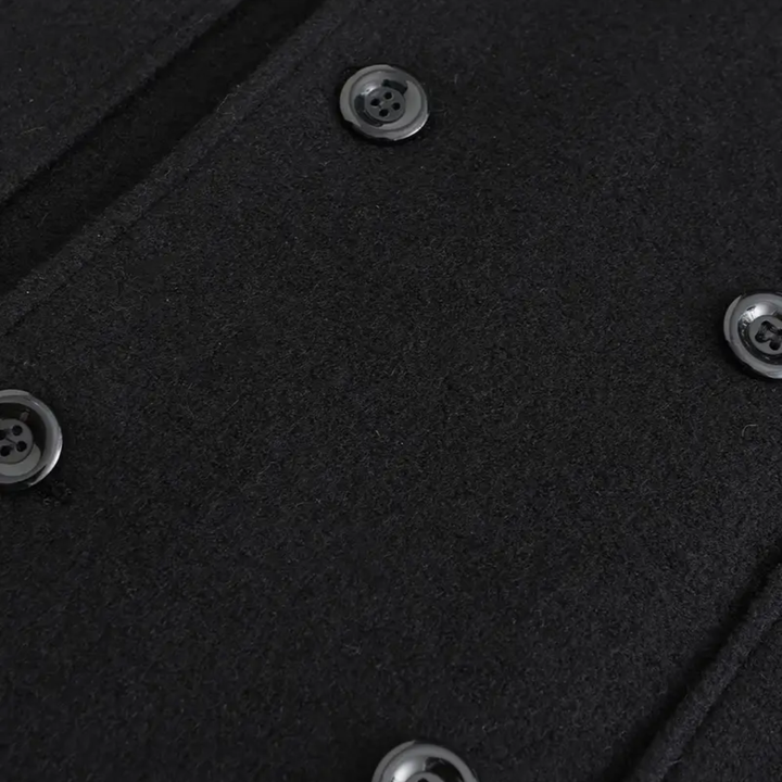 Stylish men's black double-breasted overcoat. Perfect tailored long winter coat for business and formal occasions.
