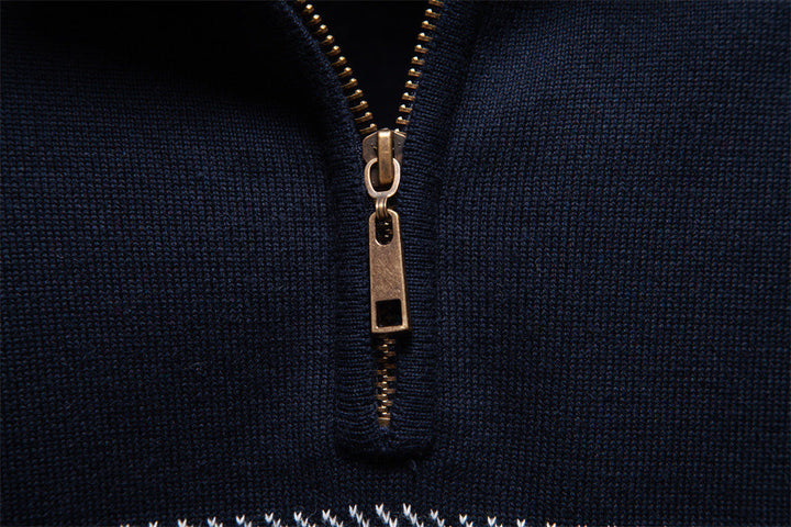 Navy blue men's smart casual half-zip pullover, enhanced with subtle striped cuffs for layering.