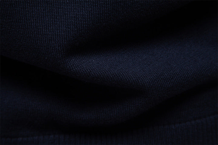 Warm men's black half-zip sweater, striped detail adds sophistication to this winter staple.