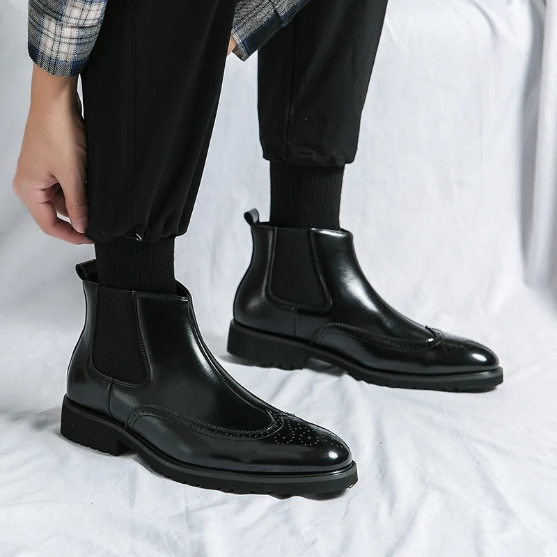 Men's slip-on black Chelsea ankle boots, offering ease of wear and comfortable, stylish design.