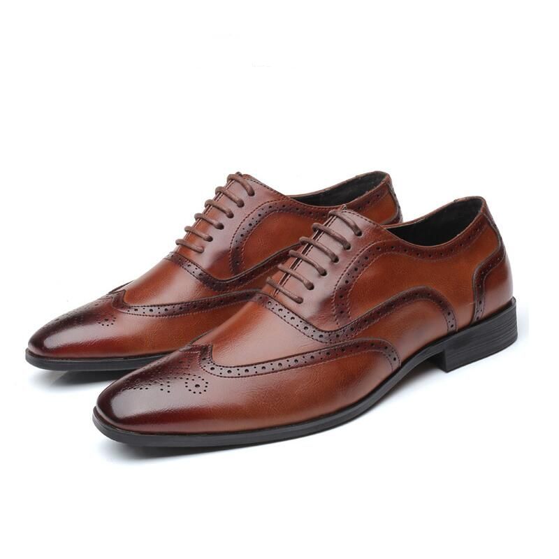 Handcrafted men's leather Oxford brogue dress shoes, offering superior comfort & timeless style.