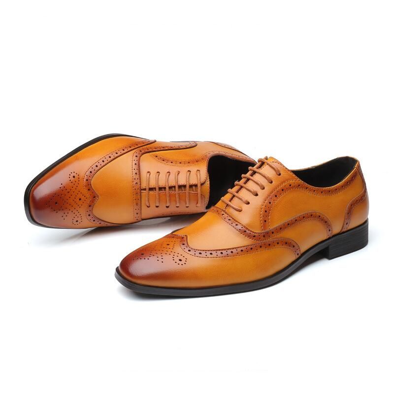 Men's genuine leather Oxford brogue dress shoes, full product view on a clean background.