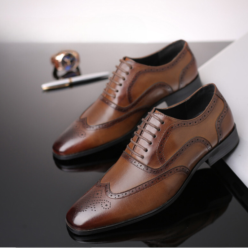 Classic men's brown Oxford brogue dress shoes, elegant and sophisticated for any gentleman.