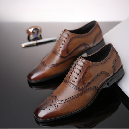 Classic men's brown Oxford brogue dress shoes, elegant and sophisticated for any gentleman.