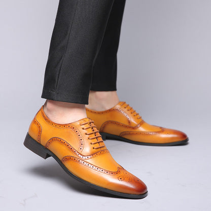 Close-up of men's Oxford brogue dress shoes, showcasing intricate detailing and classic design.