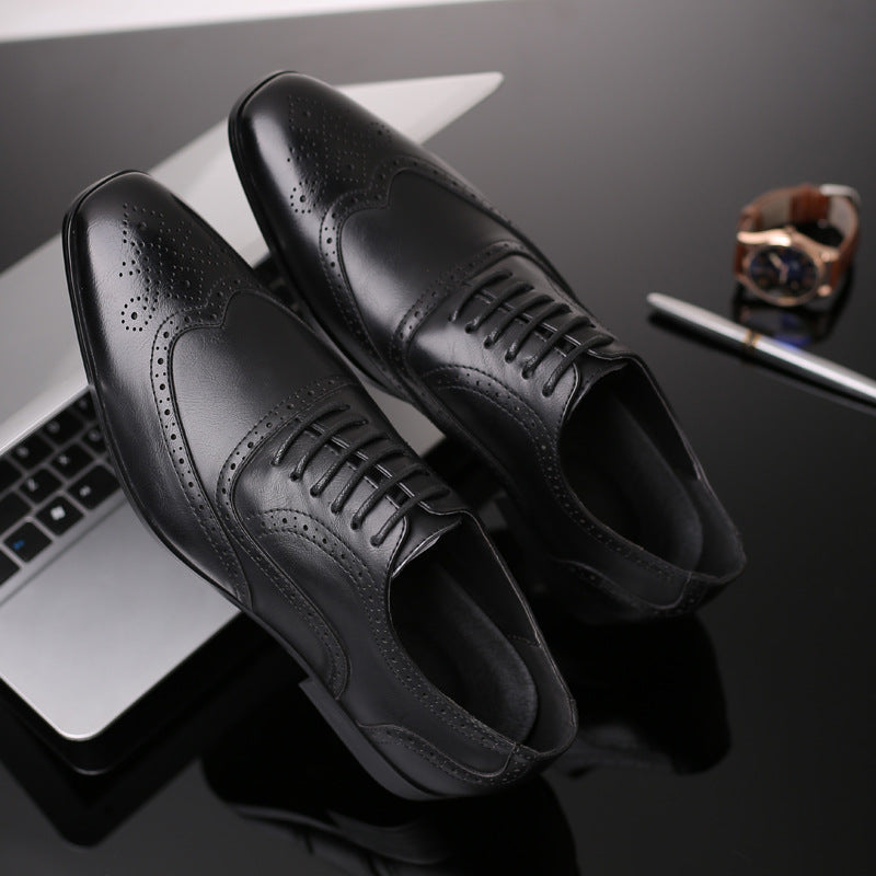 Men's Oxford brogue dress shoes paired with a suit, ideal for formal business attire.
