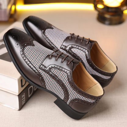 Elegant men's work shoes: wingtip design, polished leather, and timeless brogue details.
