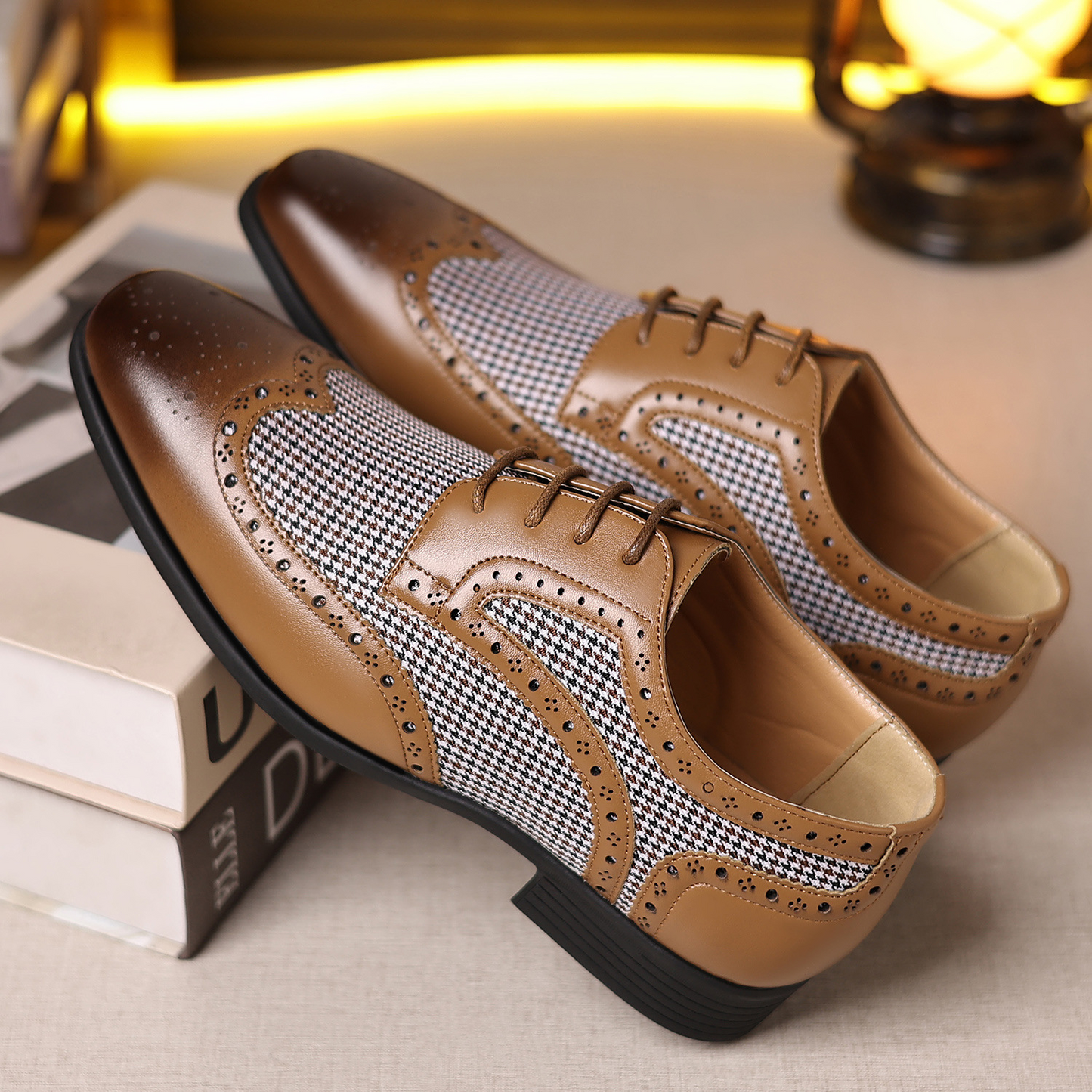 Wingtip dress shoes for men, featuring a polished finish and elegant brogue detailing.
