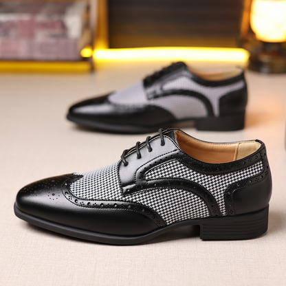 Elegant brown wingtip formal shoes for men, featuring intricate broguing and a sleek silhouette.