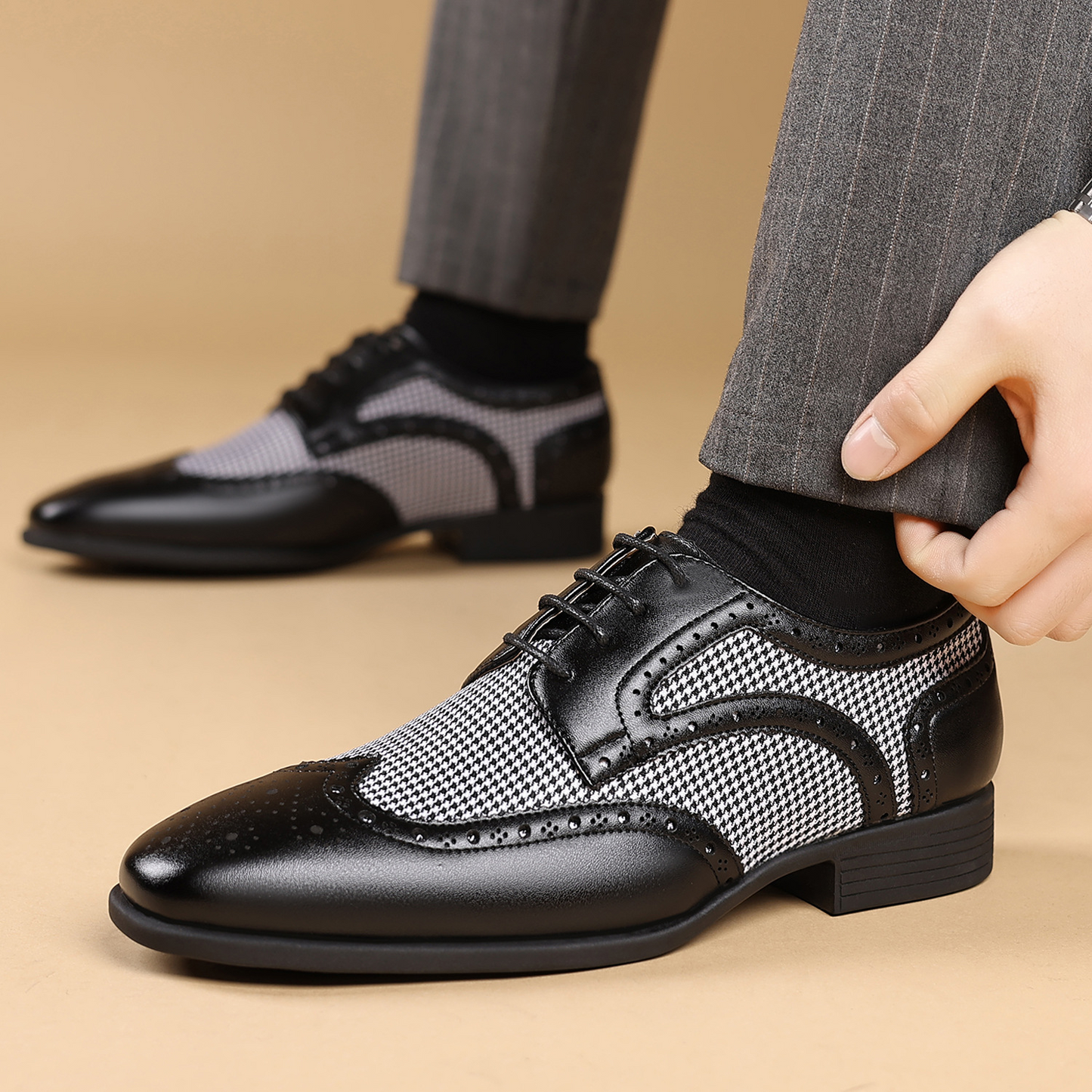 Stylish men's wingtip dress shoes in polished leather, ideal for special occasion and office wear.