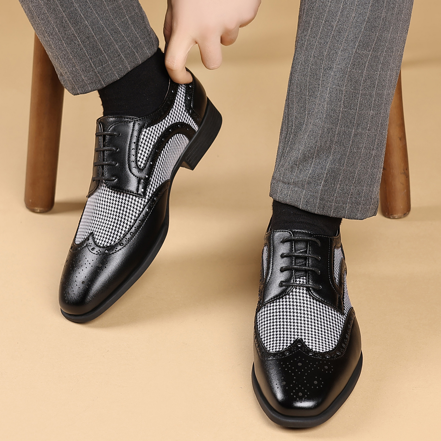 Classic men's formal brogues with a distinctive wingtip design, suitable for any business event.