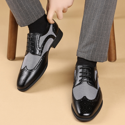 Classic men's formal brogues with a distinctive wingtip design, suitable for any business event.