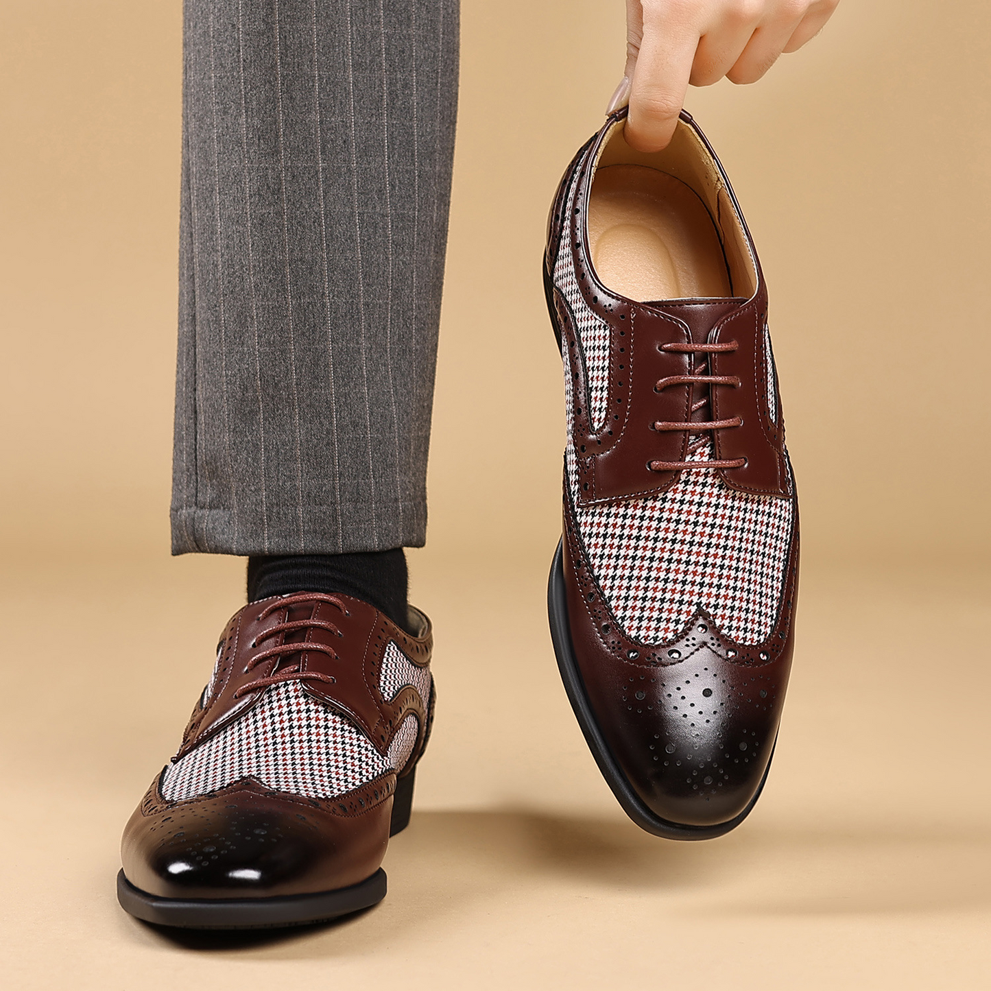 Sophisticated men's black wingtip shoes, essential for elegant business and formal occasions.