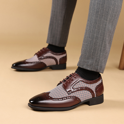 Stylish brown leather wingtip brogues for men, perfect for adding flair to formal outfits.