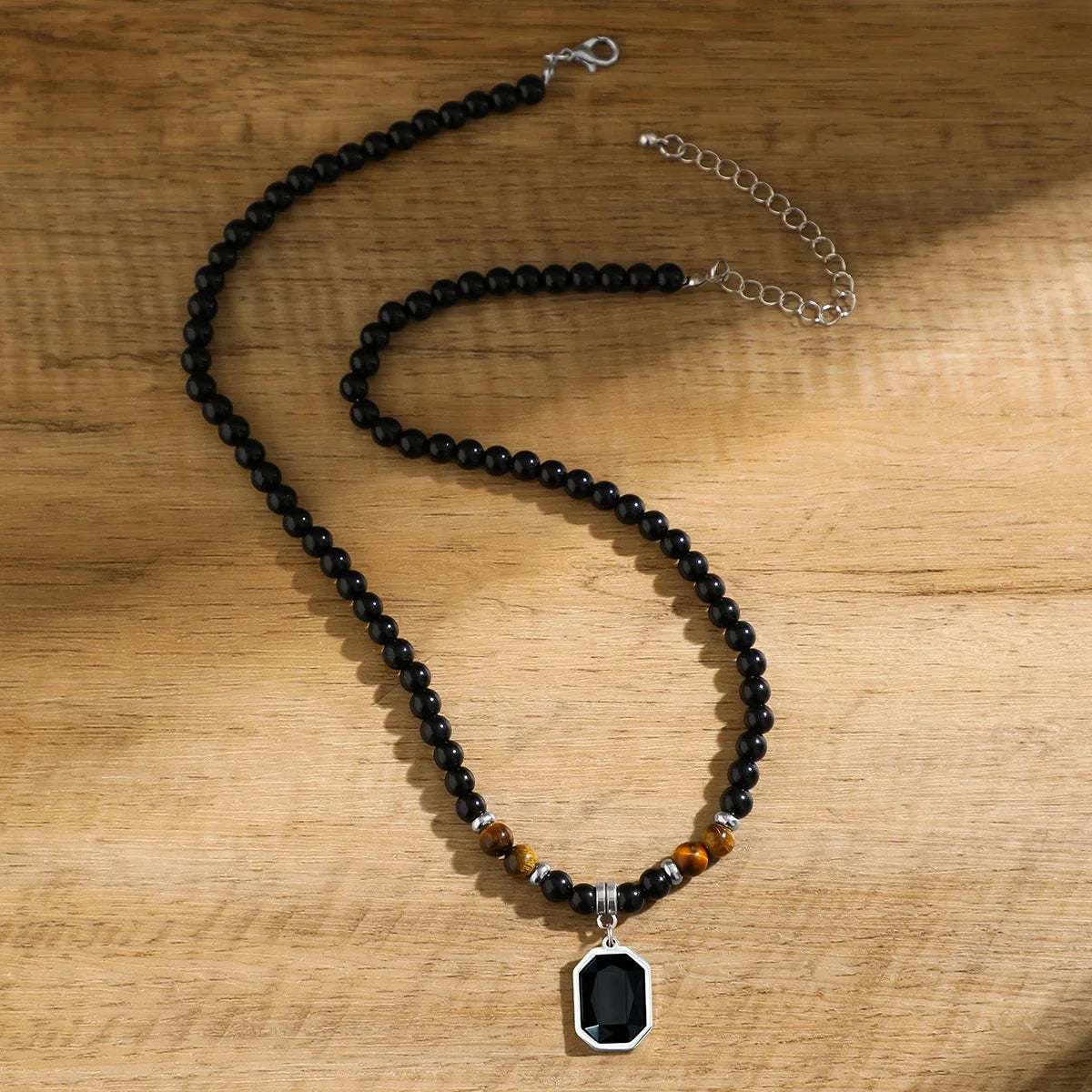 Adjustable men's black onyx beaded necklace featuring an octagon pendant & tiger's eye. Statement stone jewelry.