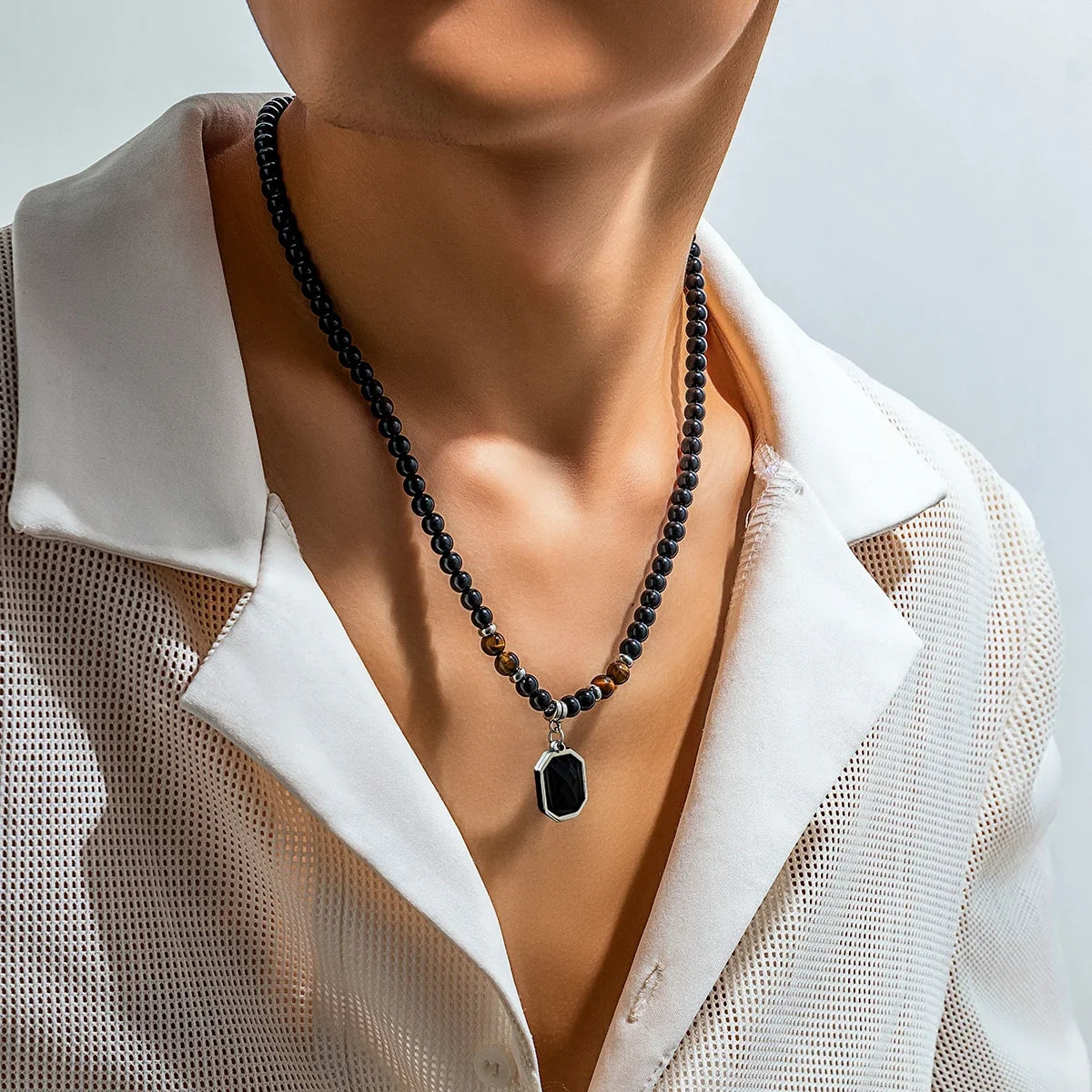 Bold mens black onyx & tiger's eye beaded necklace. A unique statement stone jewelry accessory for men.