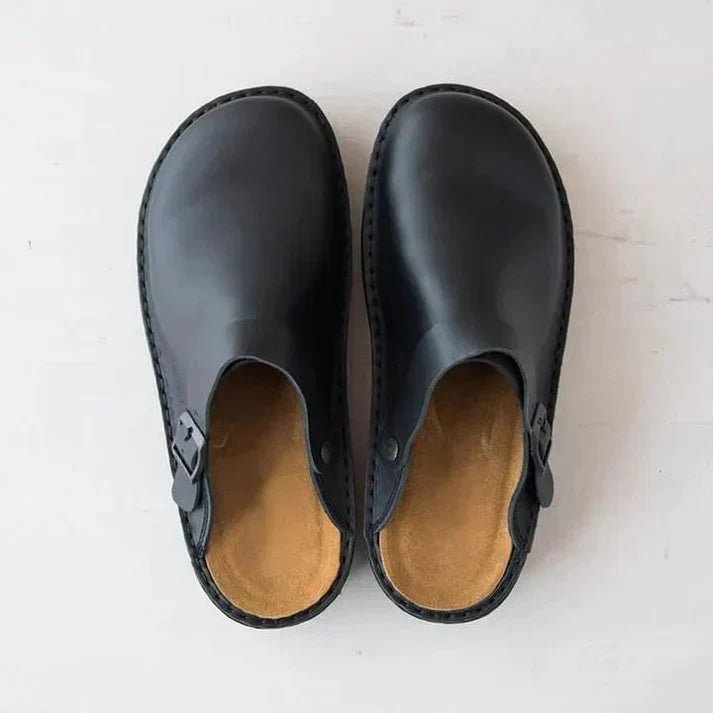Side profile of men's orthopedic clogs, highlighting the ergonomic design and essential all-day support.