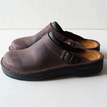 Men's comfort footwear: black leather slippers with orthopedic arch & heel support.