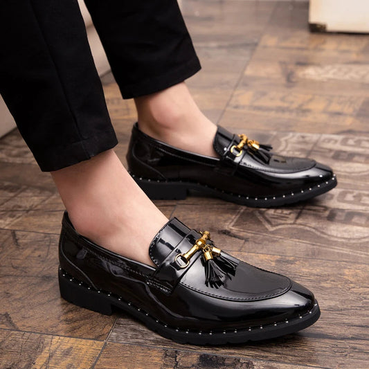 Men's black patent leather loafers with tassels, elegant formal slip-on dress shoes.