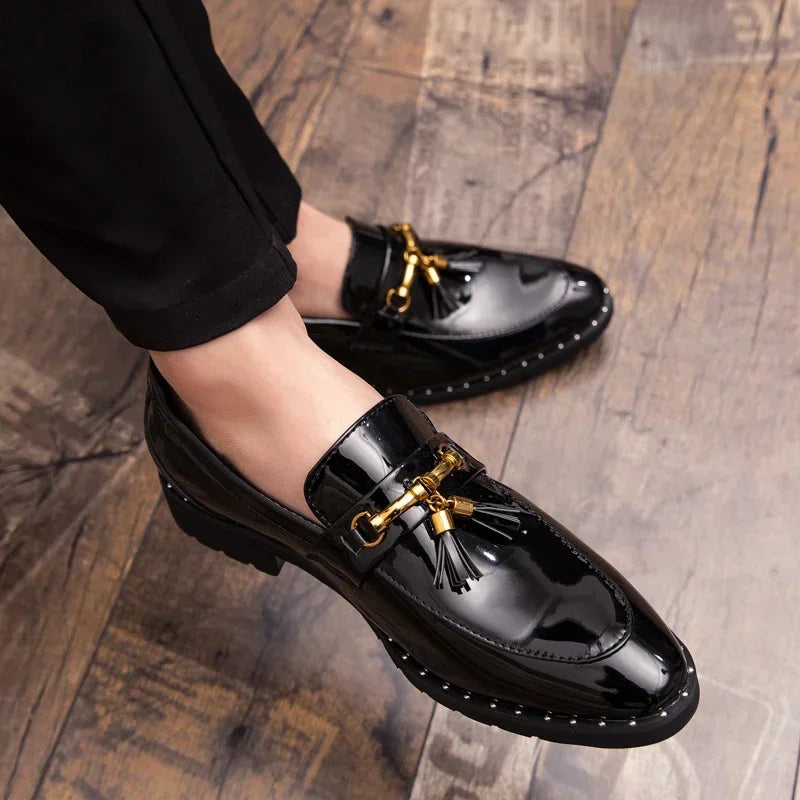 Comfortable and stylish men's patent leather loafers. Black slip-on formal shoes with tassels for a sleek look.