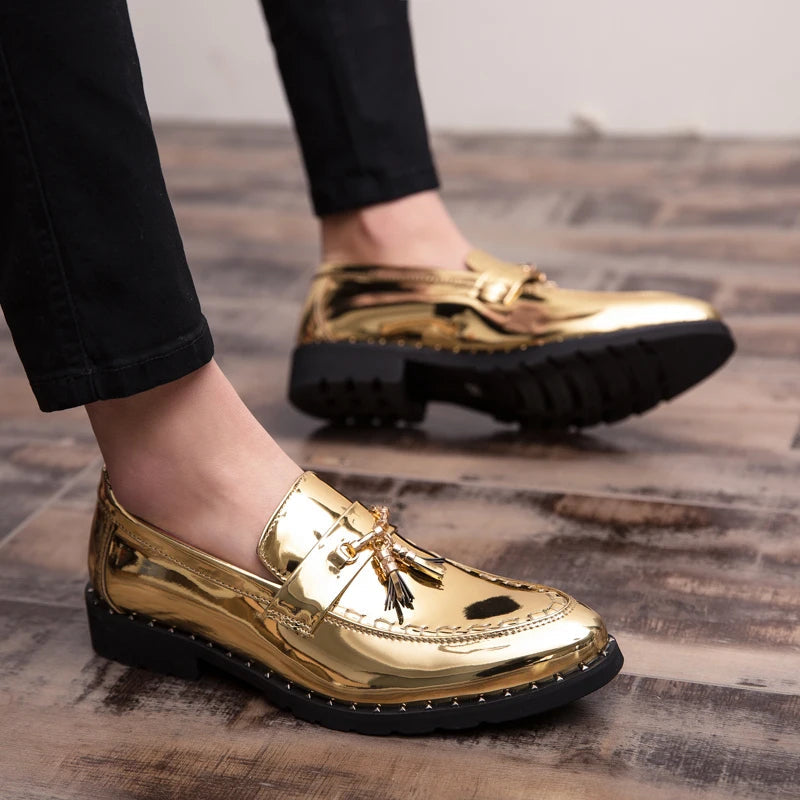 Close-up of elegant black patent loafers, highlighting intricate tassels and the glossy finish of the men's dress shoes.