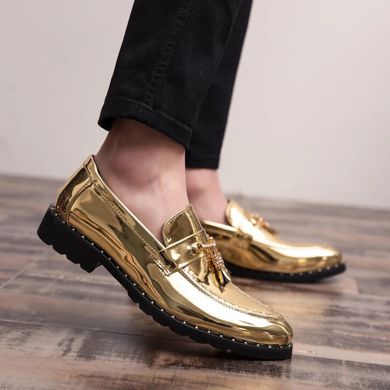 Front view of men's bold black patent loafers with stylish tassels. Perfect formal slip-on footwear.