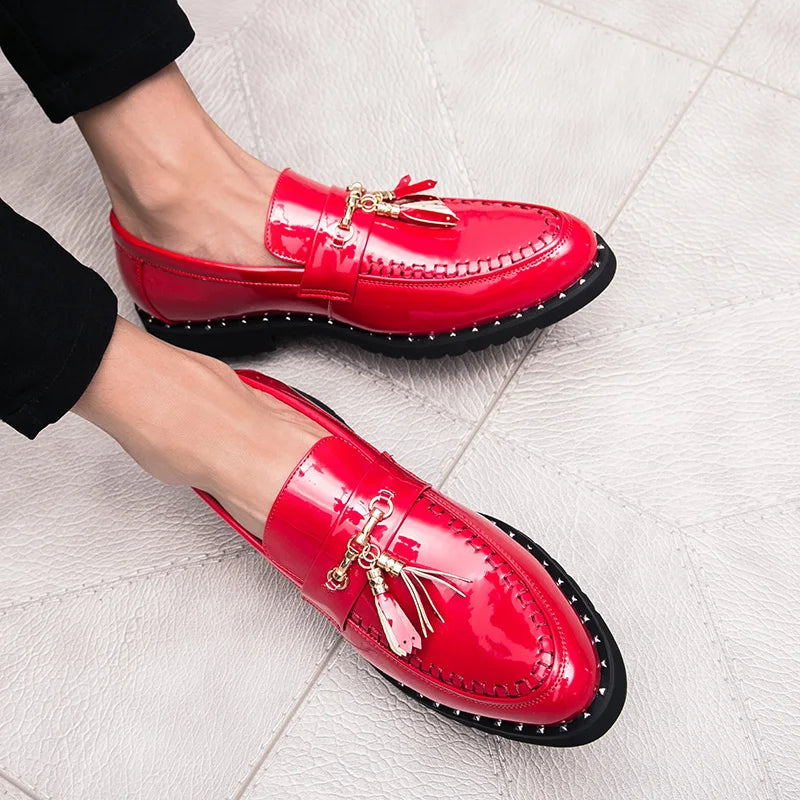Men's formal black patent slip-on loafers with tassels. Elegant dress shoes featuring a modern design and high shine.