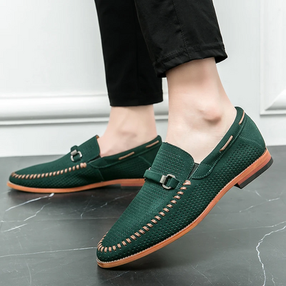 Men's black slip-on loafers with perforation, comfortable for long wear.